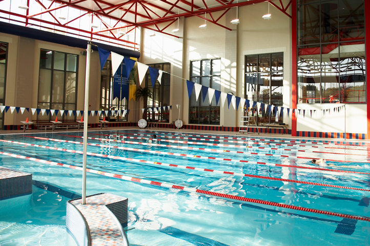 ${ A view during the daytime of the eight lane aquatic swimming pool. }